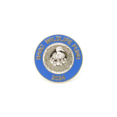 BASC Wildlife Fund 2024 lapel badge showing a mallard in a nest surrounded by ducklings, set within a blue enamel circular badge with gold-tone finish.